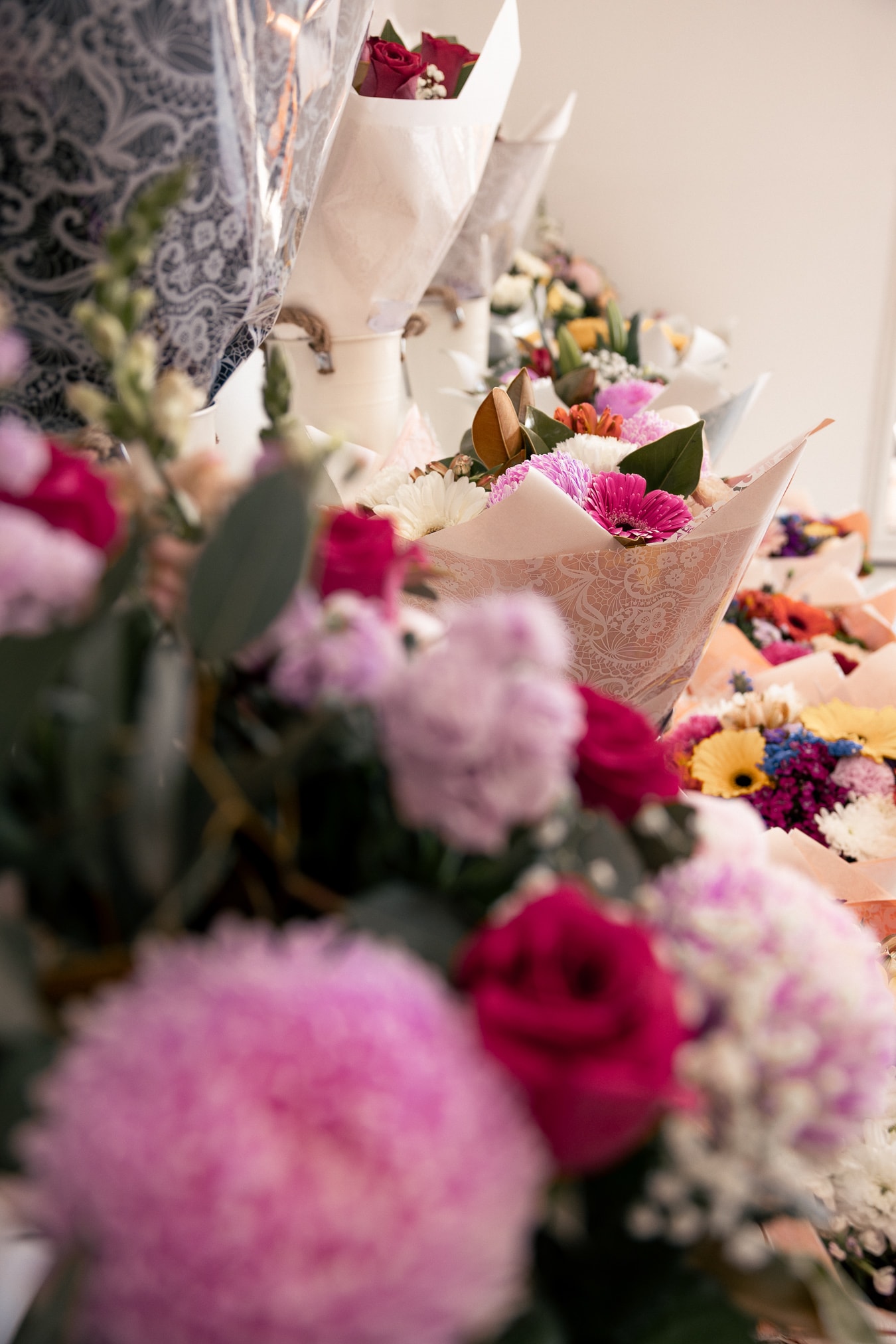 Rows of fresh wrapped bouquets on the Floral & Ko shop counter