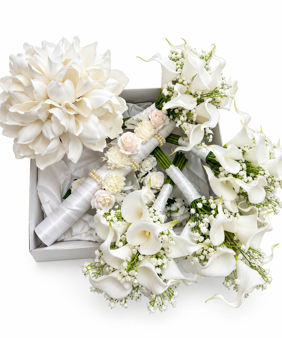 White calla lily and rose bridal bouquets laid in a gift box